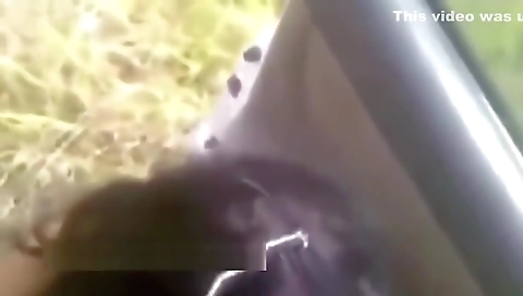 Indian milf sucking her husband in front of the car on the freeway